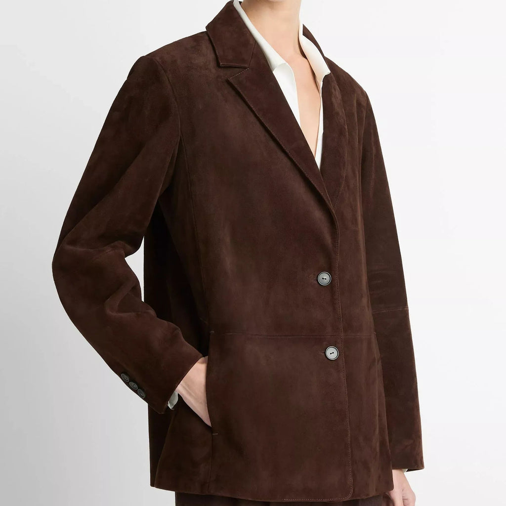 Brown suit jacket worn by a person on a white background